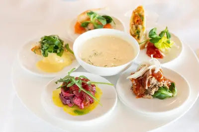 a white plate with different types of food on it at Restaurant-Hotel de Watergeus in Noorden