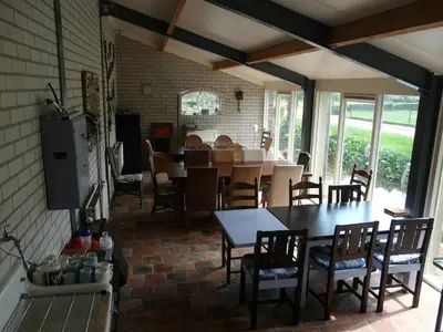a dining room with a table and some chairs at de Boomgaard Groene Hart in Polsbroekerdam