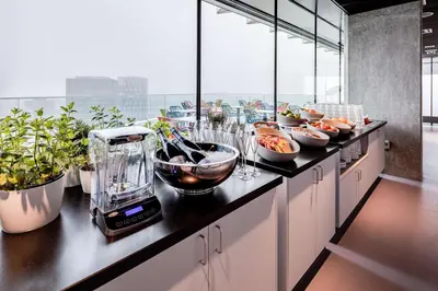 a kitchen with a counter with a blender on it at nhow Amsterdam Rai in Amsterdam