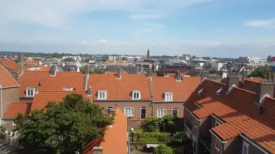 a view of a city with orange roofs at Sunnyzandvoort in Zandvoort