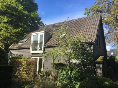 a house with a shingles roof at Villa 1913 in Bergen