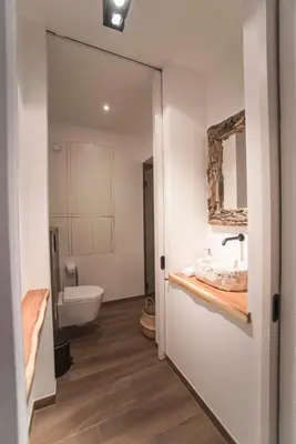 a bathroom with a sink and a toilet at Sack-Time fashion boutique hotel in Zandvoort