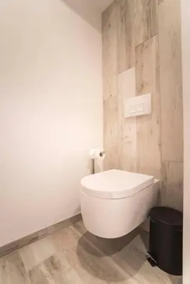 a bathroom with a white toilet in a room at Sack-Time fashion boutique hotel in Zandvoort