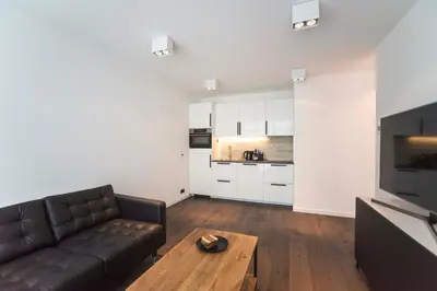 a living room with a couch and a coffee table at Sack-Time fashion boutique hotel in Zandvoort