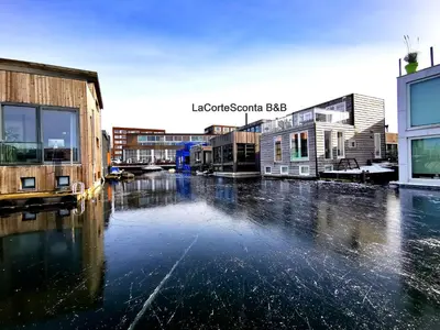 a flooded street in a city with buildings at La Corte Sconta B&B in Amsterdam