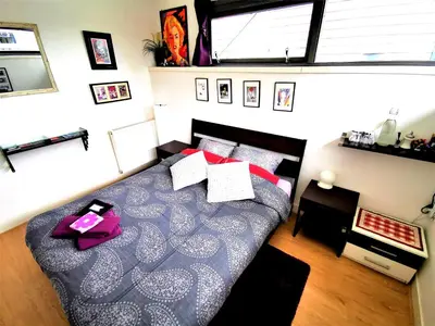 a bedroom with a large bed in a room at La Corte Sconta B&B in Amsterdam