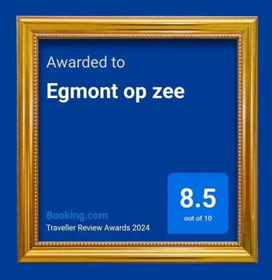a gold picture frame with a sign that readsamount uplez at Egmont op zee in Egmond aan Zee