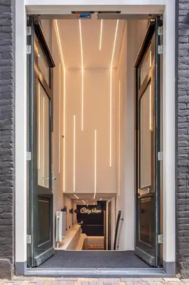 a window of a store with a sign in it at Cityview Hotel in Amsterdam