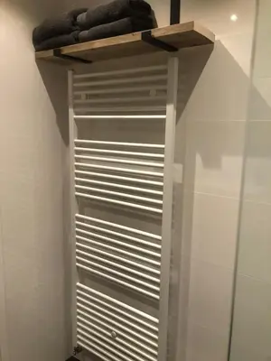 a walk in closet with blinds on a wall at Sous aan Zee in Noordwijk