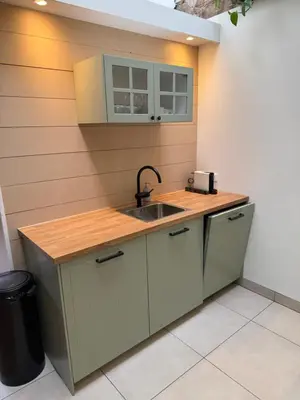 a kitchen with a sink and a counter at Spacious 70m2 apartment in city centre with lovely terrace in Alkmaar