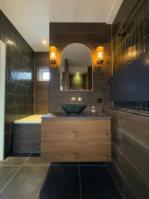 a bathroom with a sink and a mirror and a tub at Spacious 70m2 apartment in city centre with lovely terrace in Alkmaar