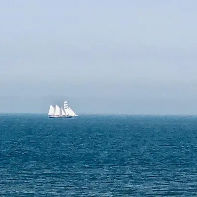 two sail boats in the ocean on the water at Casa Blanca Zandvoort in Zandvoort