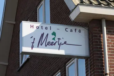 a sign for a hotel cafe meter on a building at Hotel 't Meertje in Vinkeveen
