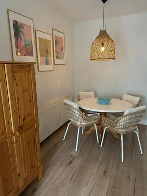 a dining room with a table and chairs at Happy Home in Zandvoort