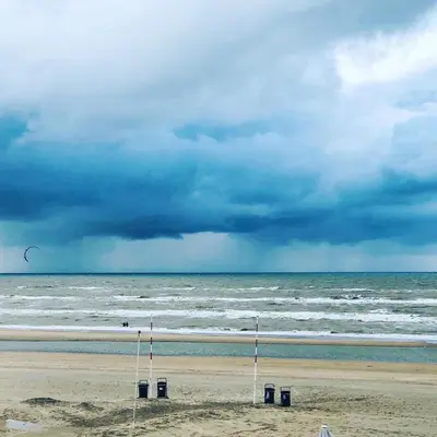 a view of the beach with a cloudy sky at Studio 4 u with private parking in Zandvoort