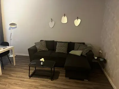 a living room with a couch and a table at Poelgeeststraat in Leiden