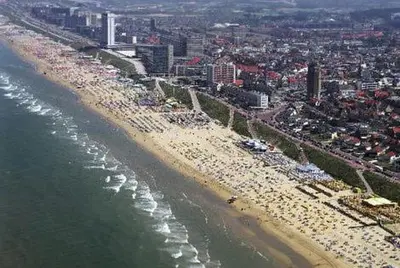 an aerial view of a beach with a crowd of people at Continentaiz Appartement in Zandvoort
