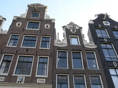 a building in amsterdam with tall windows at B&B Singel 100 in Amsterdam