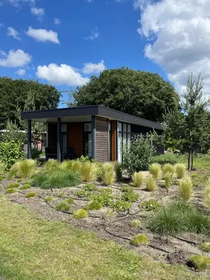 a small house in the middle of a garden at Duynparc Soest in Soest