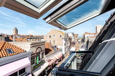 a view of a city from a balcony at Sack-Time fashion boutique hotel 6 & 7 in Zandvoort