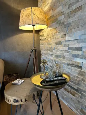 a table with a lamp and a keyboard on it at Veld en Bosch in Leusden