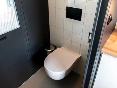a small bathroom with a white toilet in it at SWEETS - Hortusbrug in Amsterdam
