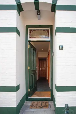 an empty hallway of a building with a door at Oosterhouse in Zandvoort