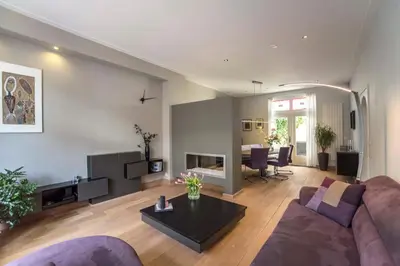 a living room with a couch and a table at Family Home Hendriks in Zandvoort