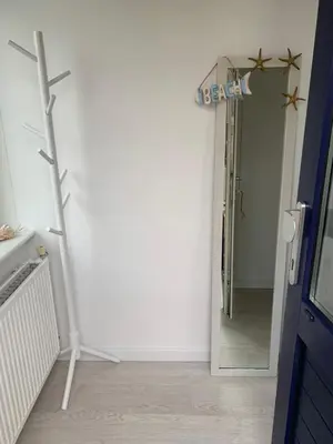 a bathroom with a mirror and a sign that reads exit at De Nollen in Egmond aan den Hoef