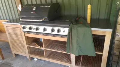 a kitchen with a stove with a coat on it at Beemster Oase in De Beemster