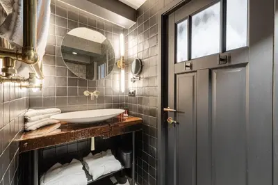a bathroom with a sink and a mirror at Boutique Hotel The Craftsmen in Amsterdam