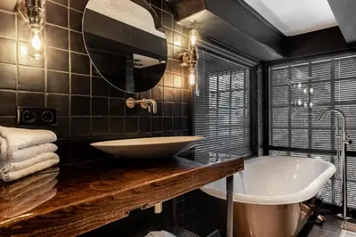 a bathroom with a sink and a bath tub at Boutique Hotel The Craftsmen in Amsterdam