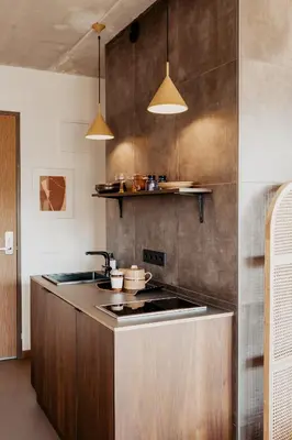 a kitchen with a sink and a counter top at Strandhotel Zoomers in Castricum