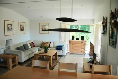 a living room with a couch and a table at Villa Pantano in Berkhout