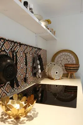 a shelf with a bunch of items on a wall at Sunny Guesthouse in Bergen