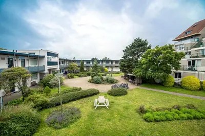 a garden in the middle of a building at Blue Shell With Private Parking Garage in Zandvoort