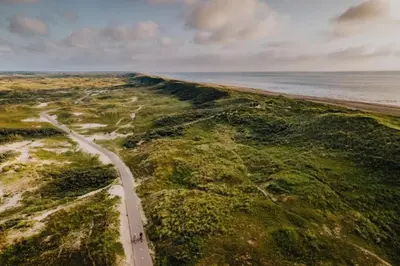 an aerial view of a road next to the ocean at Blue Shell With Private Parking Garage in Zandvoort