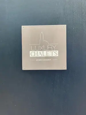 a sign on a wall that says luxury chates at Luxury Chalets Monnickendam in Monnickendam