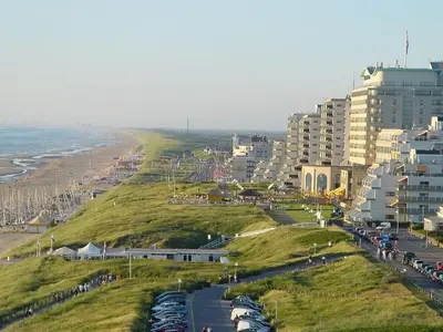 a view of a city with a beach and buildings at ZeeBedStay in Noordwijk aan Zee