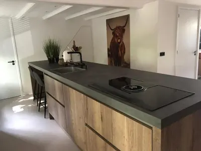 a kitchen with a counter top with a sink at Bergenshofje in Bergen