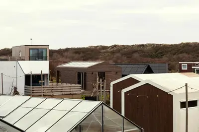 a view of a group of buildings in a city at Basecamp Tiny House Eco-resort IJmuiden in IJmuiden