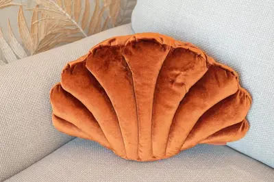 a large orange shell sitting on top of a table at KUST Zandvoort Private Parking included in Zandvoort