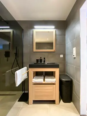 a bathroom with a sink and a mirror at Studio 23 in Zandvoort