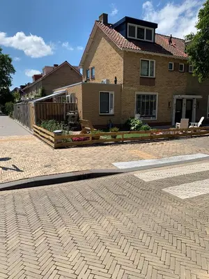 a house with a brick driveway in front of a house at B&B Diemerplein in Amsterdam