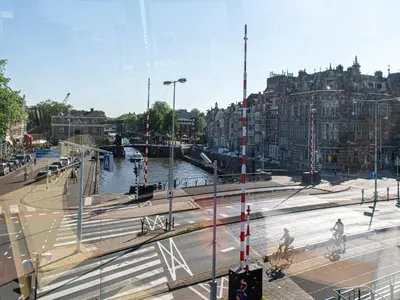a view of a city with a river and buildings at SWEETS - Kortjewantsbrug in Amsterdam