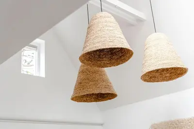 three baskets hanging from the ceiling in a room at Suite-Suite luxury private guesthouse in Zandvoort