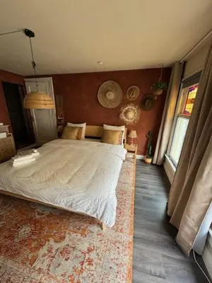 a bedroom with a large bed in a room at Toast by night in Haarlem