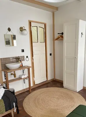 a room with a bathroom with a sink and a door at Toast by night in Haarlem