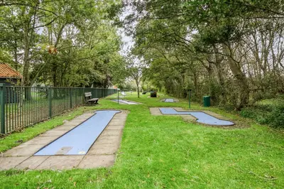 a row of tramp trays in a park at Rekerlanden 154 in Schoorldam