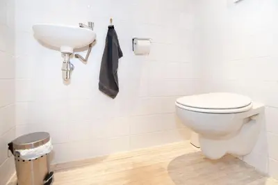 a bathroom with a toilet and a sink at Bed & Breakfast of Art in Amsterdam